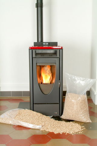 Modern Domestic Pellet Stove With A Burning Flame
